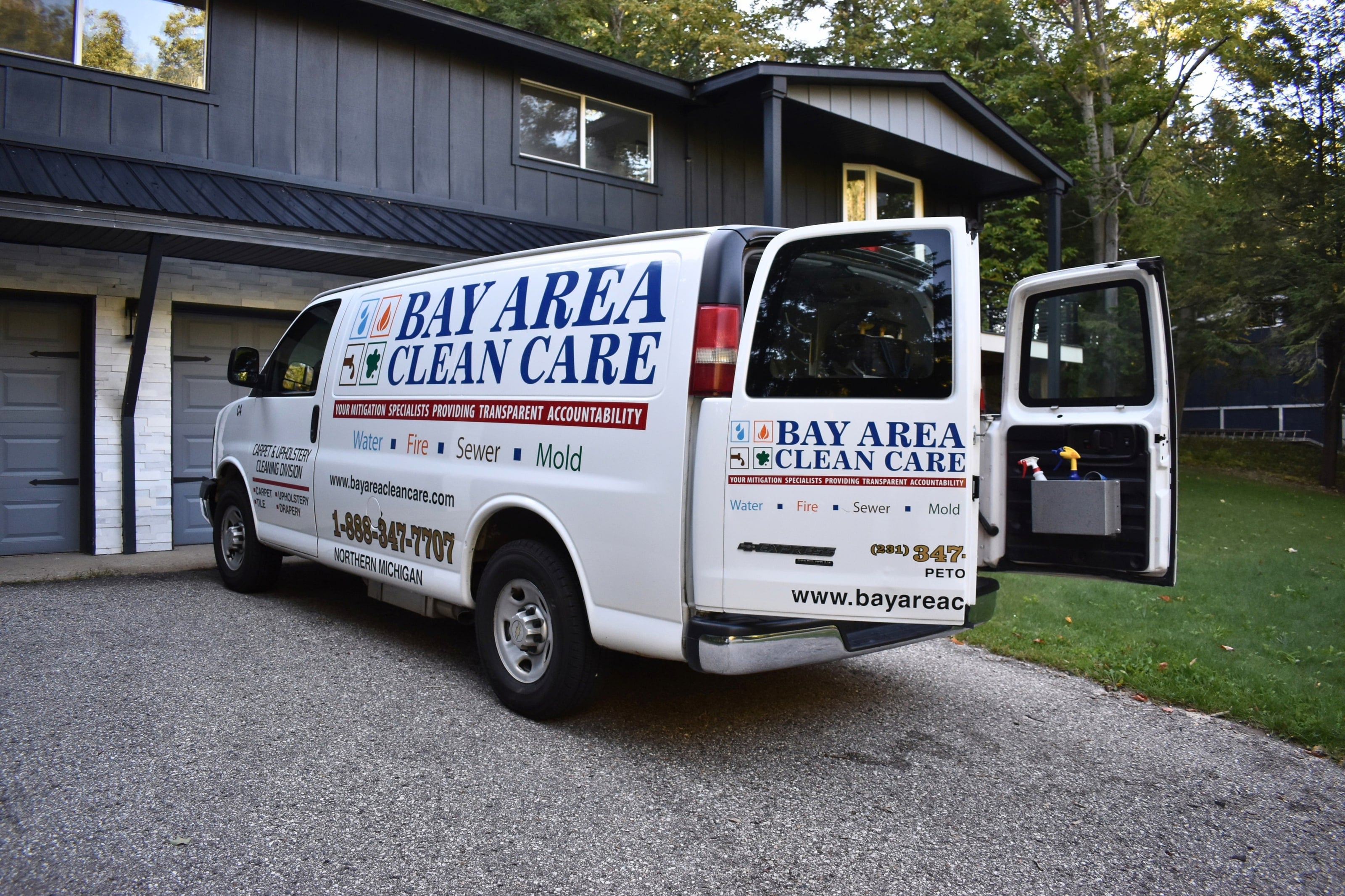 The Bay Area Clean Care carpet and upholstery cleaning van parked at a client's home